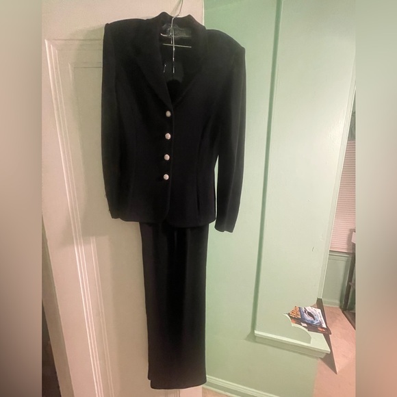 St John Black Chic 2 pc suit with decorative buttons, great condition.